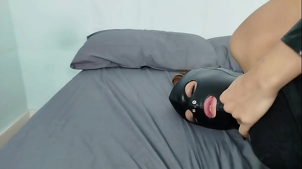 Petty BDSM slut playing with her wet pussy whipped by her master with slave leather mask until orgasm